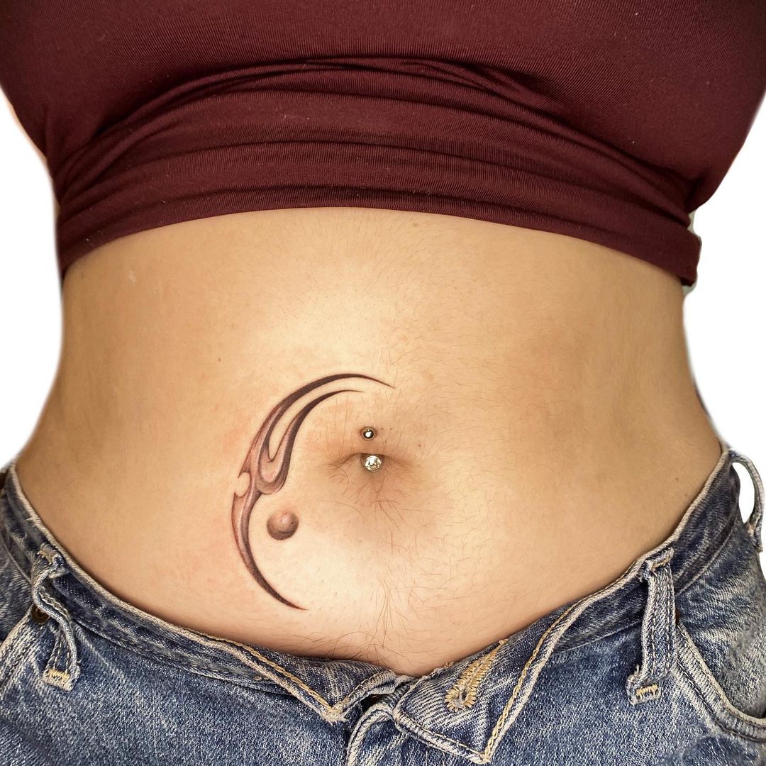 Unique belly button tattoo