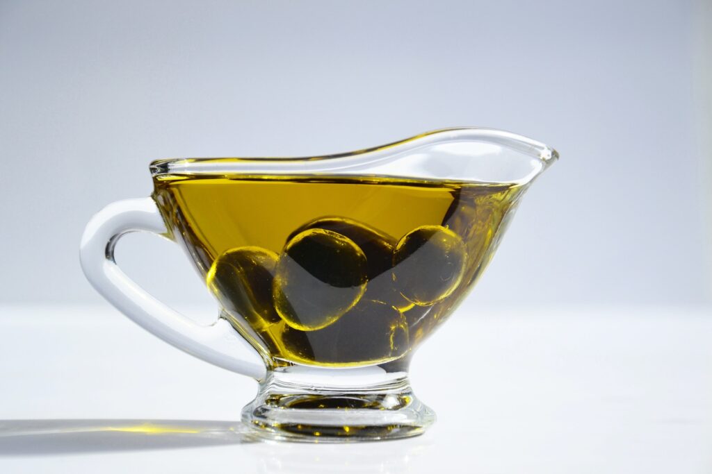 Olives in a cup of olive oil    
