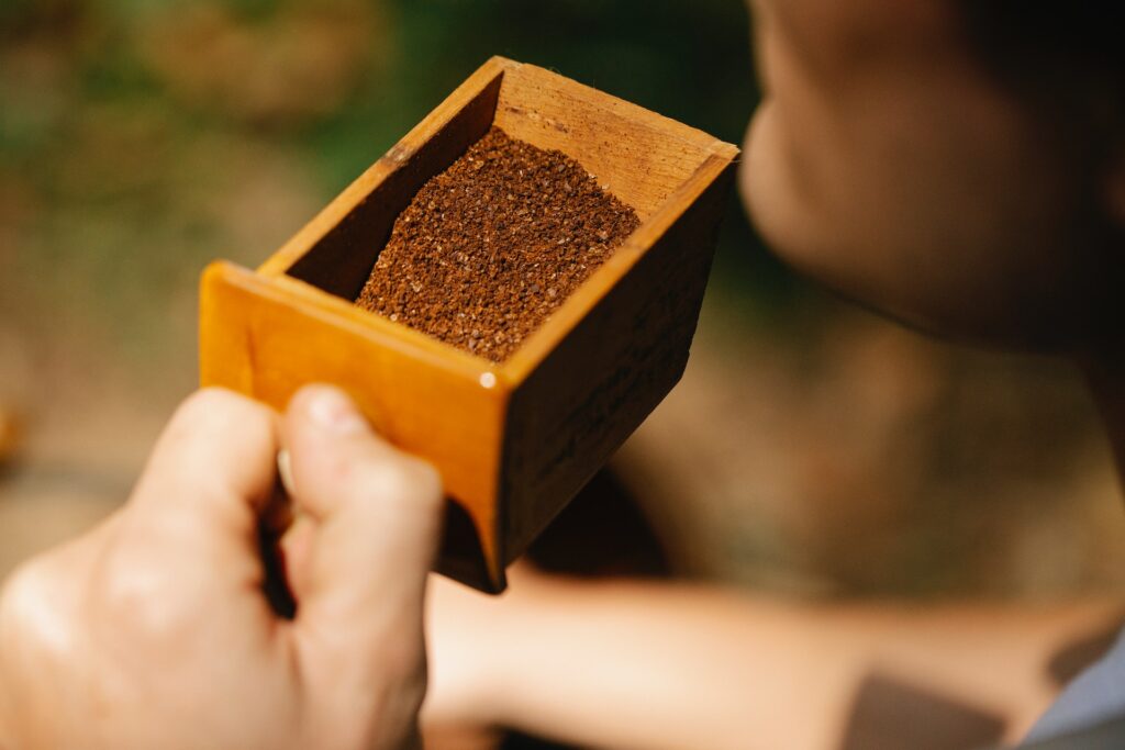 Ground coffee in a brown container