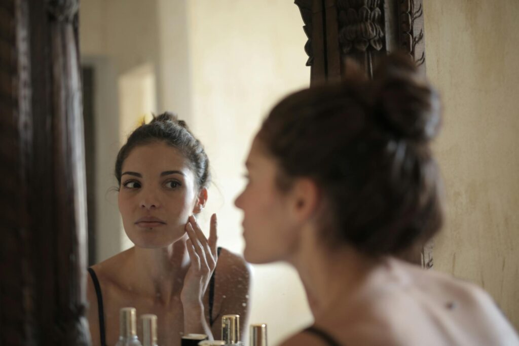 Woman applying skincare routine
